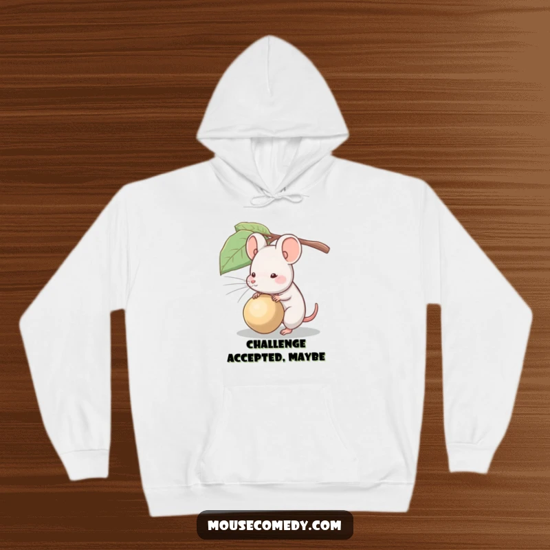 Funny hoodie featuring a mouse struggling humorously to drag along a seed much larger than it is.