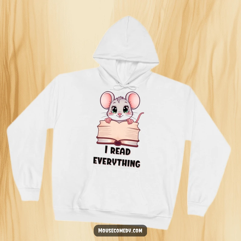 Funny hoodie with a kawaii mouse peeking over a large book, its eyes wide with curiosity, offering cozy comfort for readers.