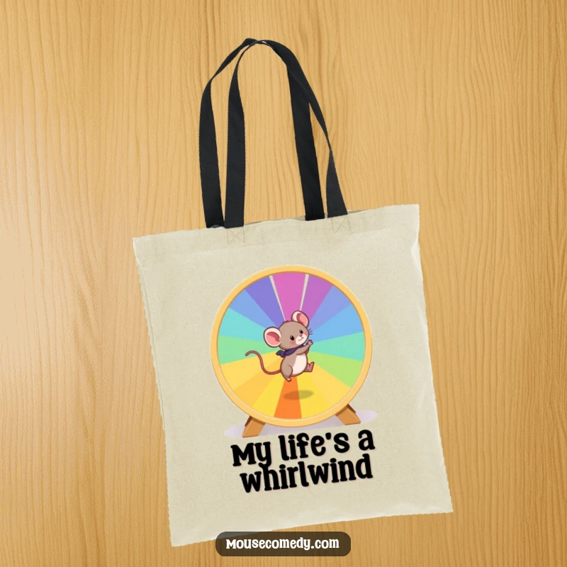 Funny Mouse Tote Bag: A playful mouse is captured mid-run on a giant, colorful hamster wheel, a symbol of motion.